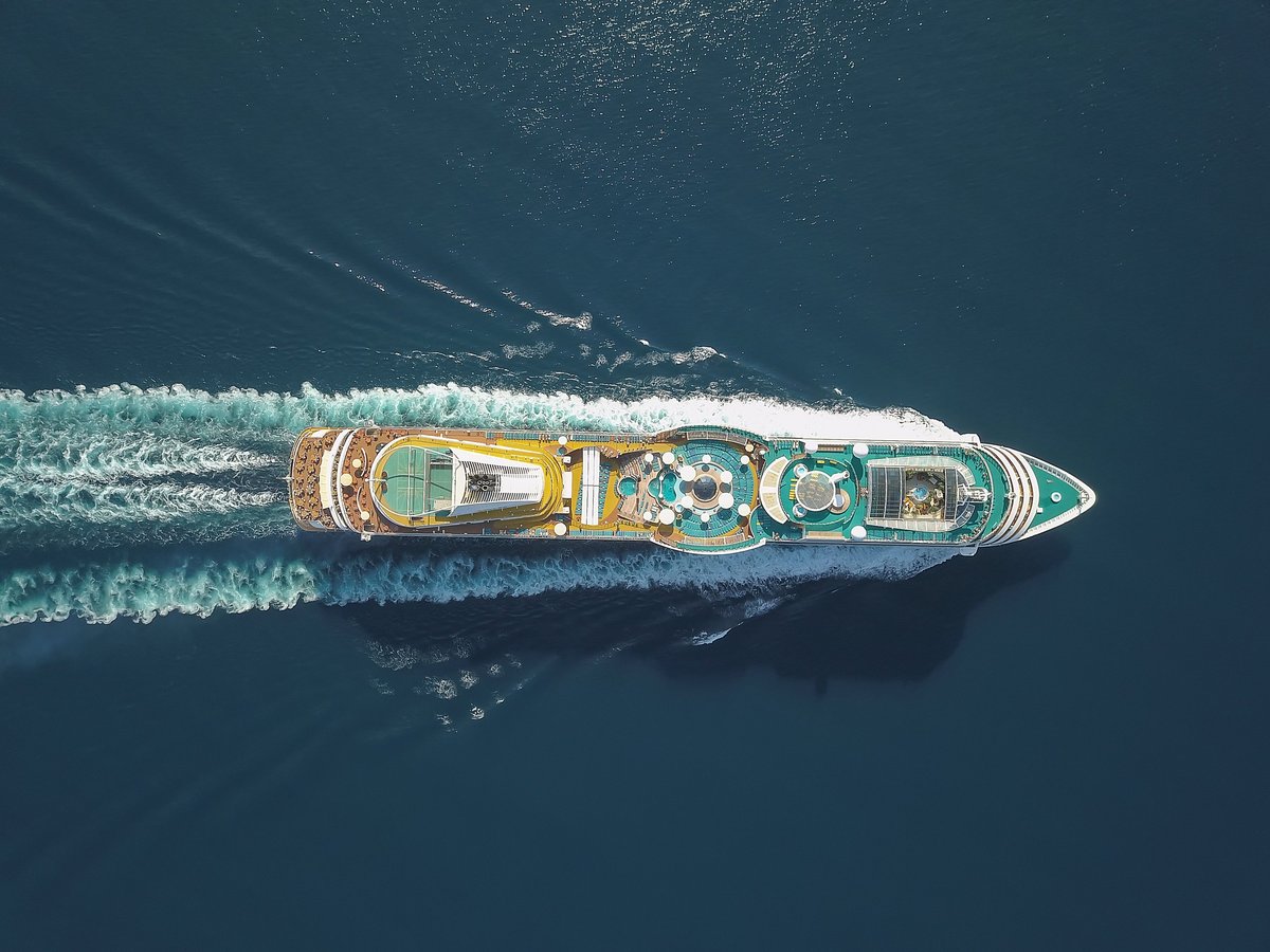 Aerial view of a large cruise ship at sea near Ksamil