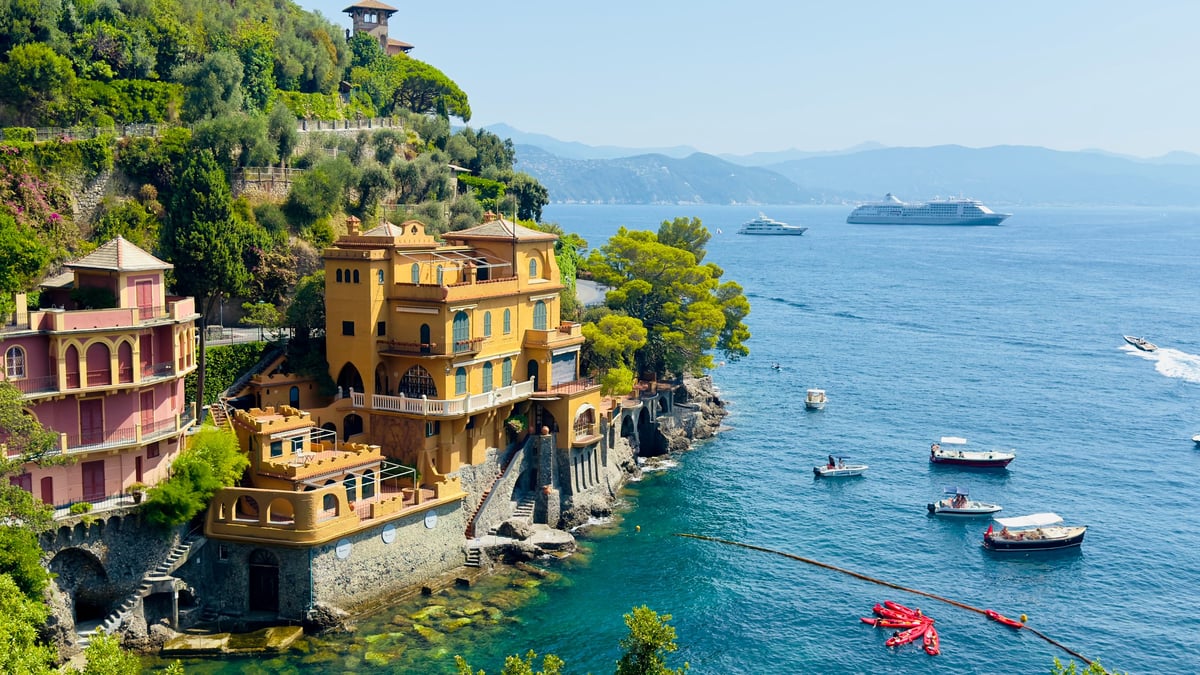 Elegant Mediterranean coastline with villas and boats